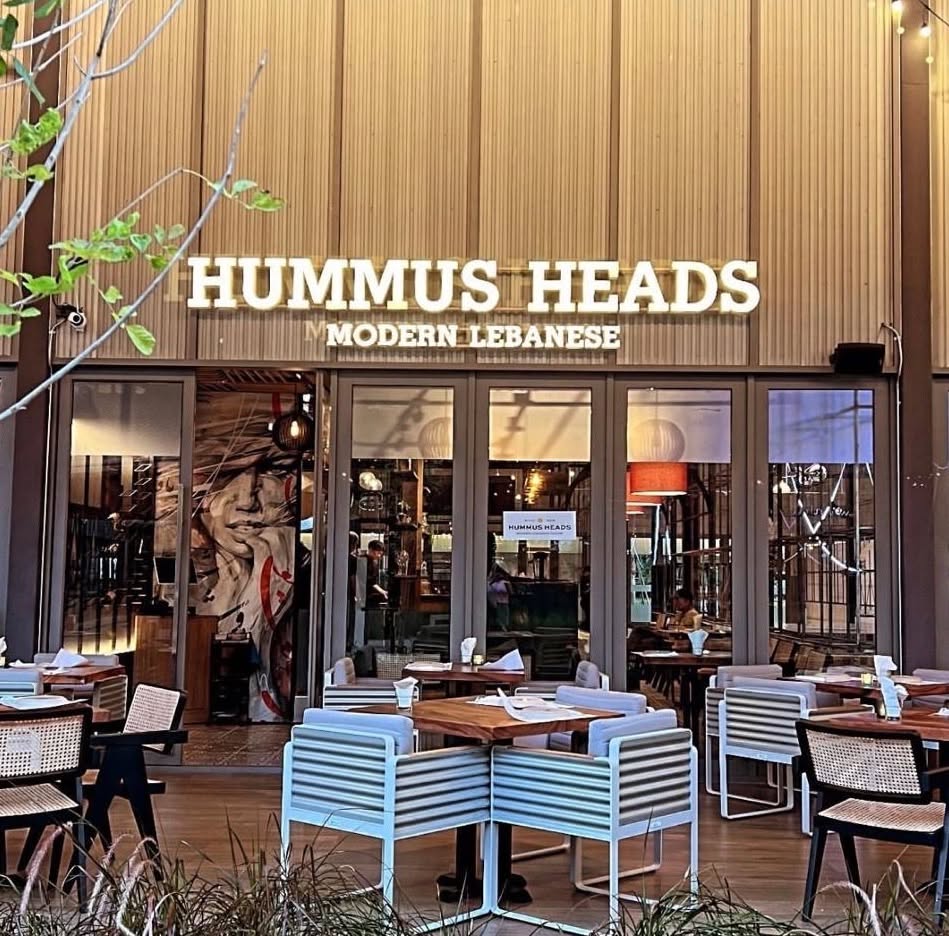 A shared platter of hummus dips, crispy shrimp and wings at Hummus Heads Bangtao